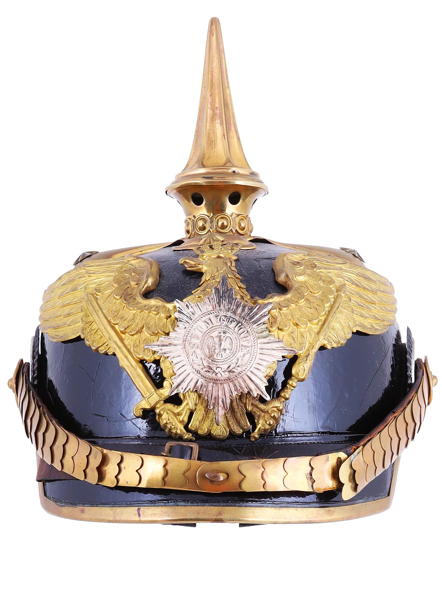 A WWI PRUSSIAN GUARD INFANTRY PICKELHAUBE HELMET: World War I-era German An Imperial German Guard dragoon officer's pickelhaube, constructed of lacquered black leather, with a brass circular plate at the crown bearing four rivets, topped with a 3 1/2