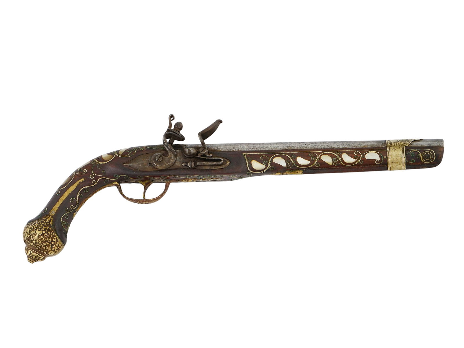 A MOTHER-OF-PEARL INLAID ISLAMIC FLINTLOCK PISTOL, CA. 19TH CENTURY: A Middle Eastern flintlock pistol of the late 18th or early 19th century. Possesses a beautiful wooden stock with mother-of-pearl and brass inlays throughout, a rounded brass pommel with repoussé dec