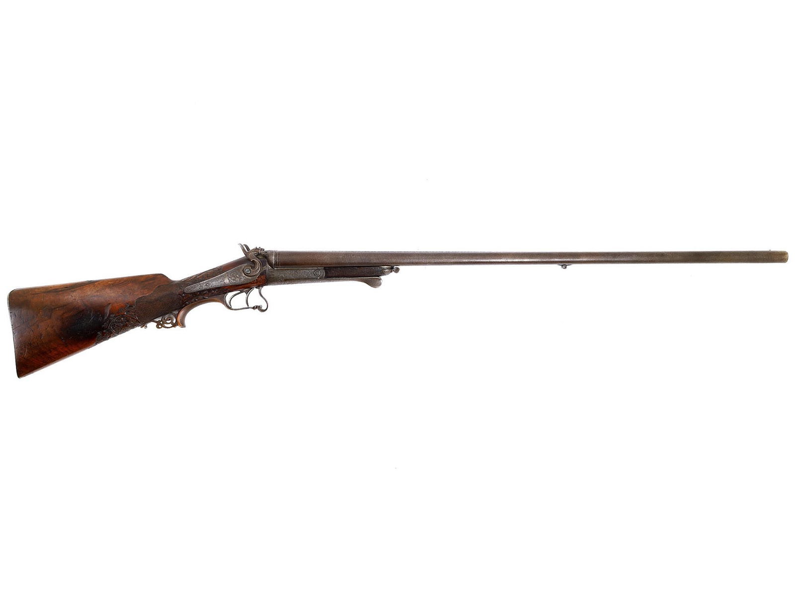A GERMAN SHOTGUN WITH DAMASCUS STEEL BARRELS, 19TH CENTURY: Fine German shotgun, 1870-80. Made in Soemmerda, Germany by Franz von Dreyse. The barrels are made of Damascus steel with a beautiful pattern. The barrel rail also made of Damascus steel is decorated 