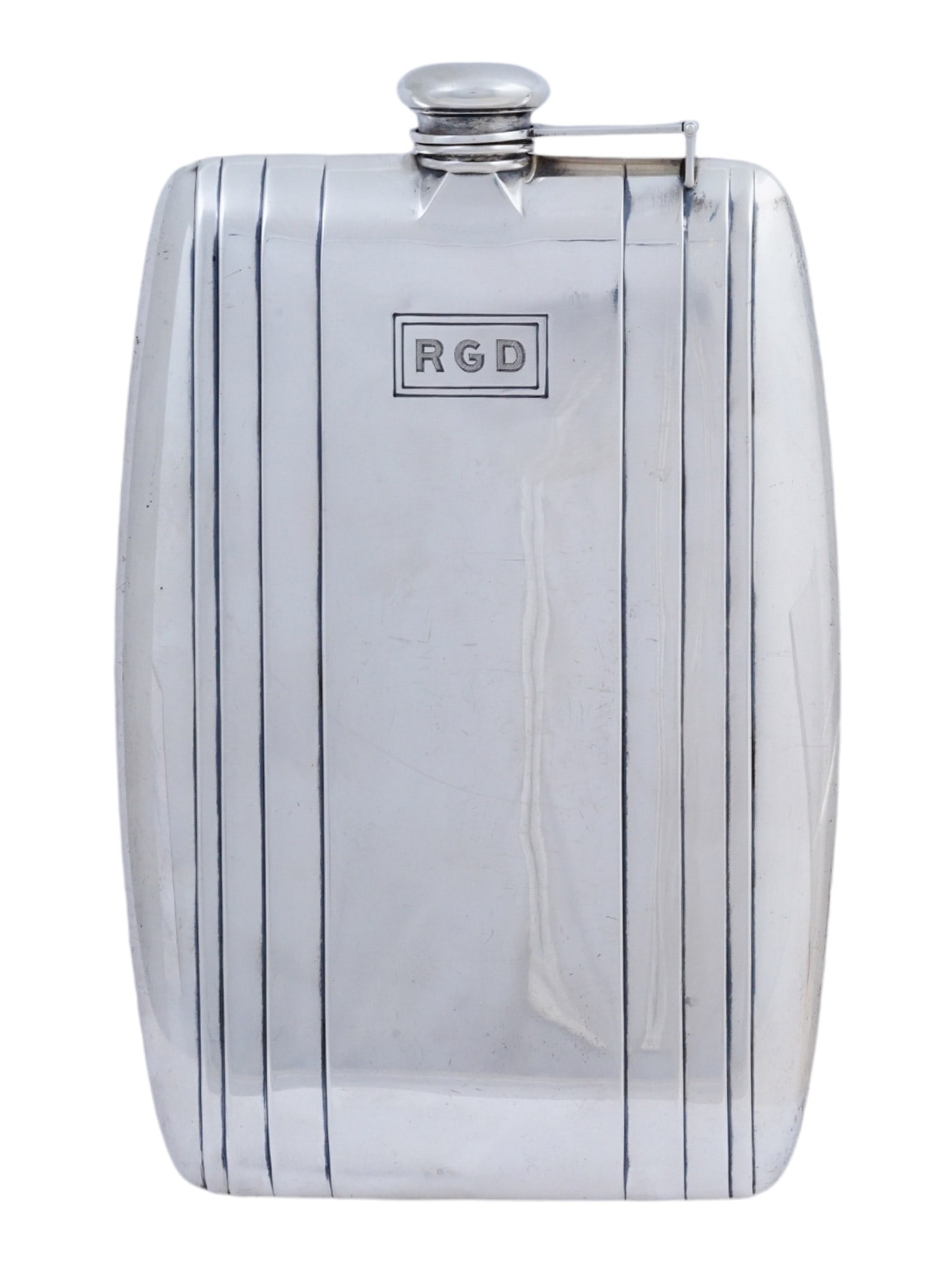 AN ART DECO WATROUS FOR INTERNATIONAL STERLING SILVER FLASK: Watrous for International Sterling, sterling silver flask from the early 20th century and in Art Deco style, with an elegant, geometric design. It measures 7 1/4'' in height by 4 1/3'' in width by 2/3
