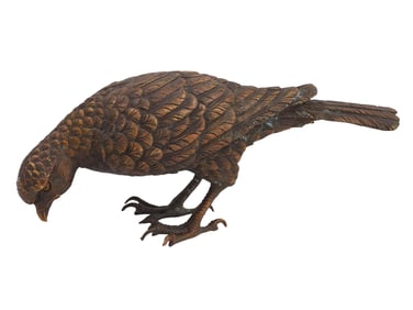 A VIENNESE BRONZE EAGLE STANDING ON TWO LEGS, CIRCA 1890