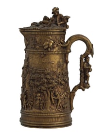 A CAST-BRONZE FIGURAL REPOUSSE LIDDED TANKARD, 19TH CEN.