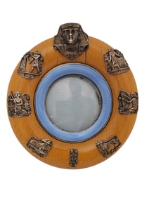 A WOOD AND ENAMEL CIRCULAR FRAME WITH SILVER-GILT MOUNTS