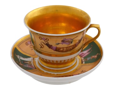 A RUSSIAN GILT PORCELAIN CUP AND SAUCER