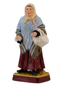 A RUSSIAN PORCELAIN FIGURE OF AN OLD WOMAN BY GARDNER, 19TH C.