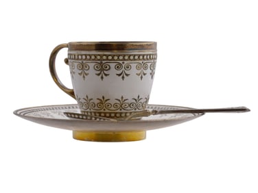 A SILVER AND ENAMEL COFFEE CUP, SAUCER, AND SPOON