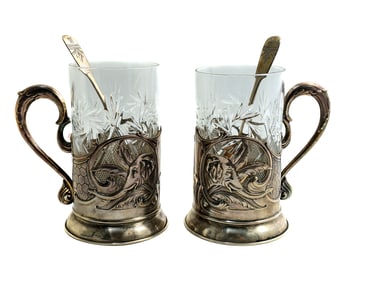 A PAIR OF SOVIET RUSSIAN SILVER TEA GLASS HOLDERS WITH CUT CRYSTAL GLASSES, 1930
