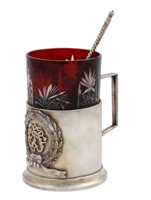 A RUSSIAN SILVER TEAGLASS HOLDER WITH A SPOON, CA. 1900