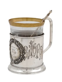 A RUSSIAN ENGRAVED SILVER TEA CUP HOLDER, CA 1901
