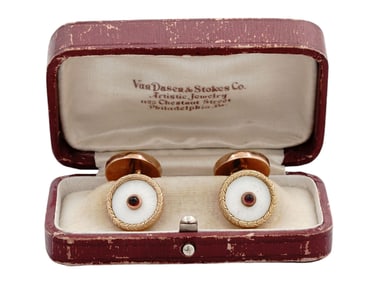 A CASED PAIR OF GOLD CUFFLINKS SET WITH ENAMEL AND RUBIES, IMPERIAL RUSSIA