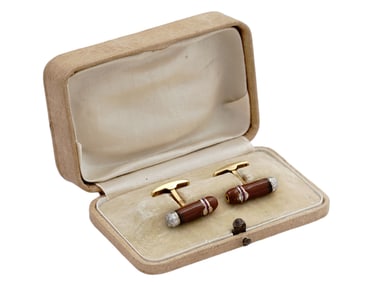 A CASED PAIR OF CIGAR CUFFLINKS SET WITH GOLD, DIAMONDS, AND ENAMEL