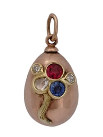 AN IMPERIAL RUSSIAN GOLD EASTER EGG SET WITH GEMSTONES, CA. 1900