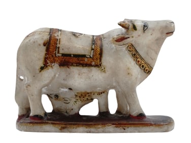 A PAINTED AND CARVED ALABASTER COW WITH A FEEDING CALF, INDIA