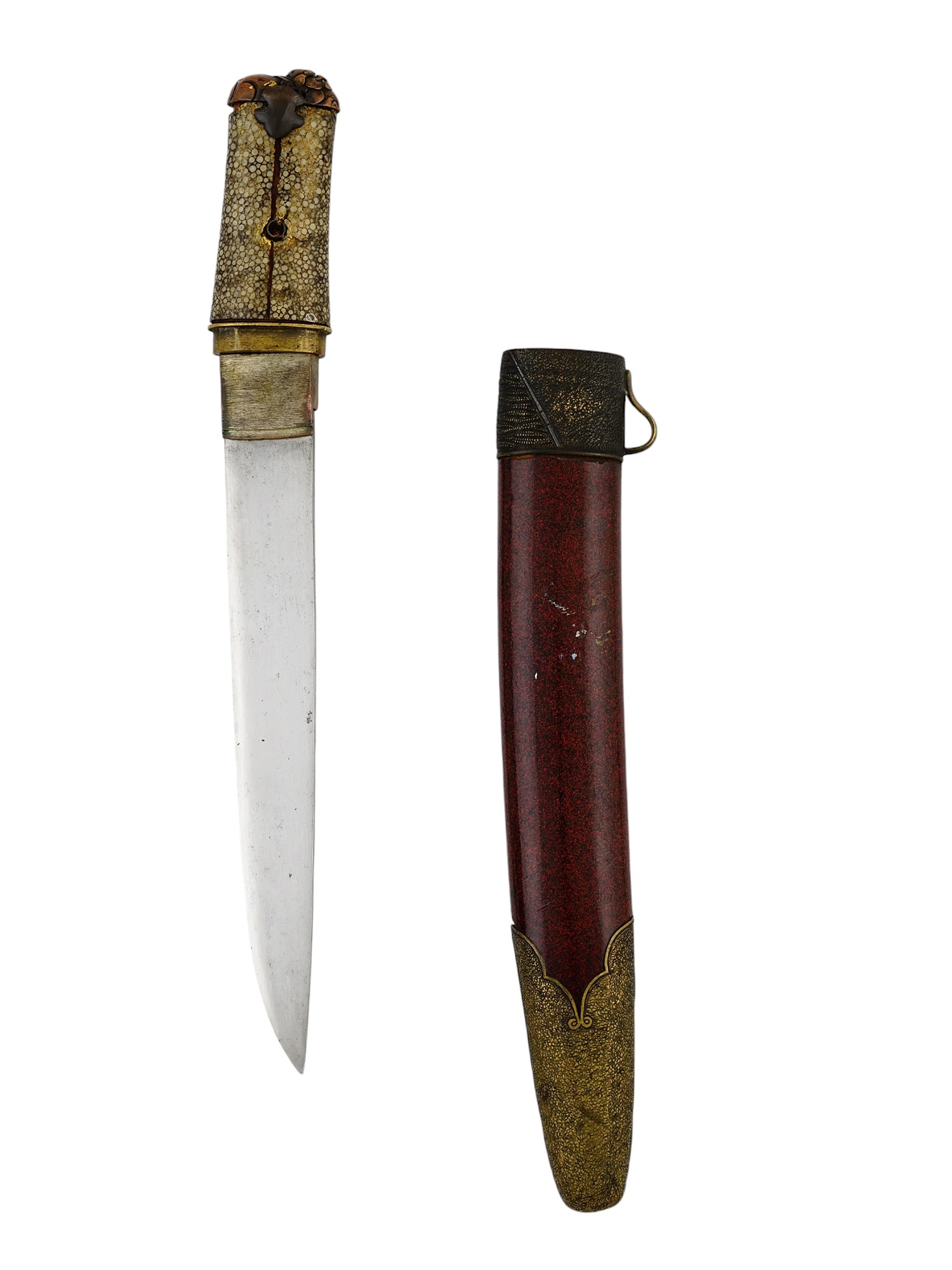 AN EDO JAPANESE TANTO WITH SHAGREEN GRIP AND RED LACQUER SCABBARD: A Japanese tanto of the Edo period with a fine shagreen grip with a gilt finish and a kashira depicting a beast laying down. The red lacquer scabbard is affixed with brass mounts with a variety of too