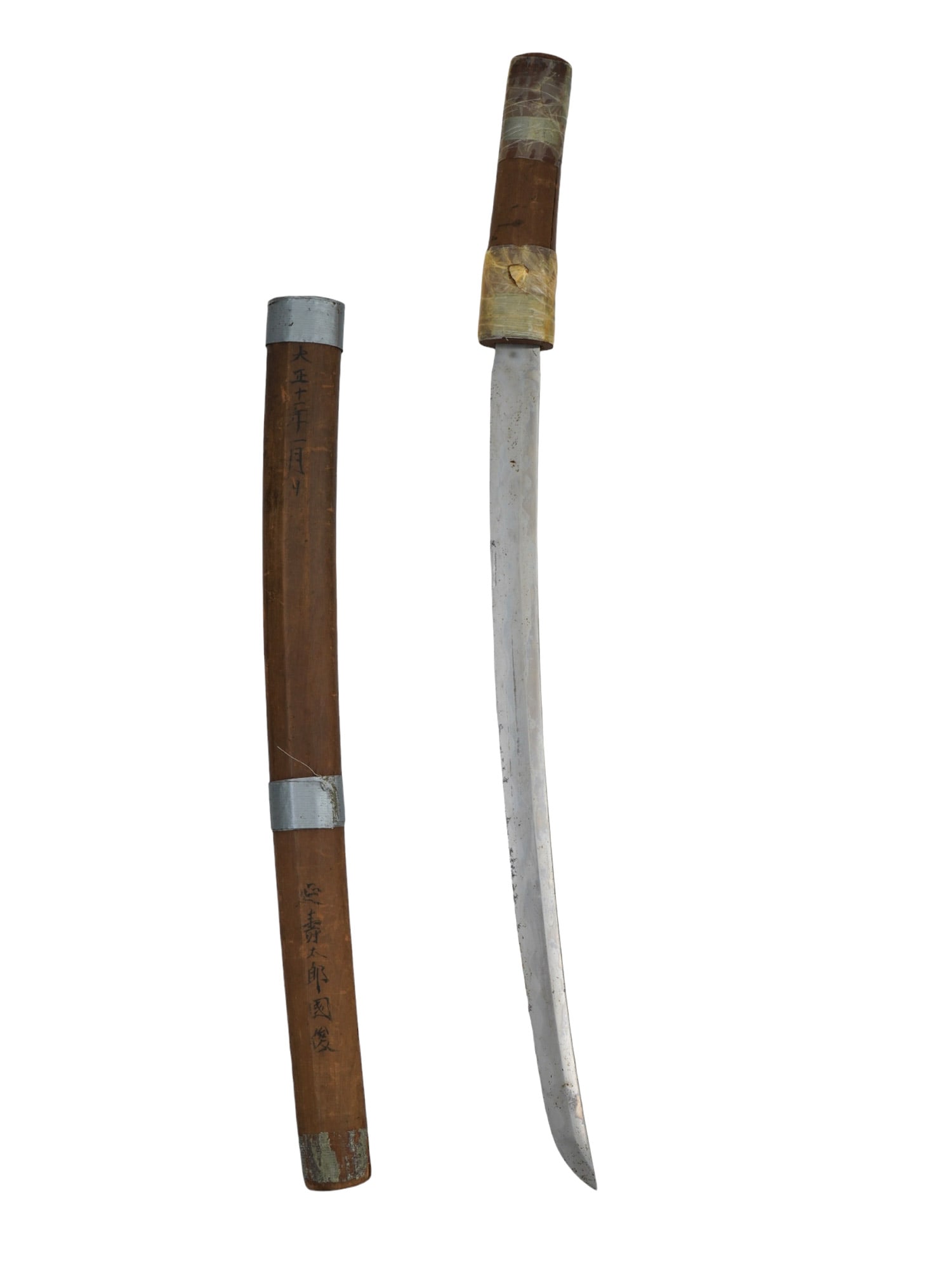 A JAPANESE KATANA IN A WOODEN SAYA WITH KANJI TEXT: A Japanese katana kept in a wooden saya with kanji text which appears to place this sword in the first quarter of the 20th century. Dimensions: L: 26 in., (66 cm.) Please make all inquiries before bid