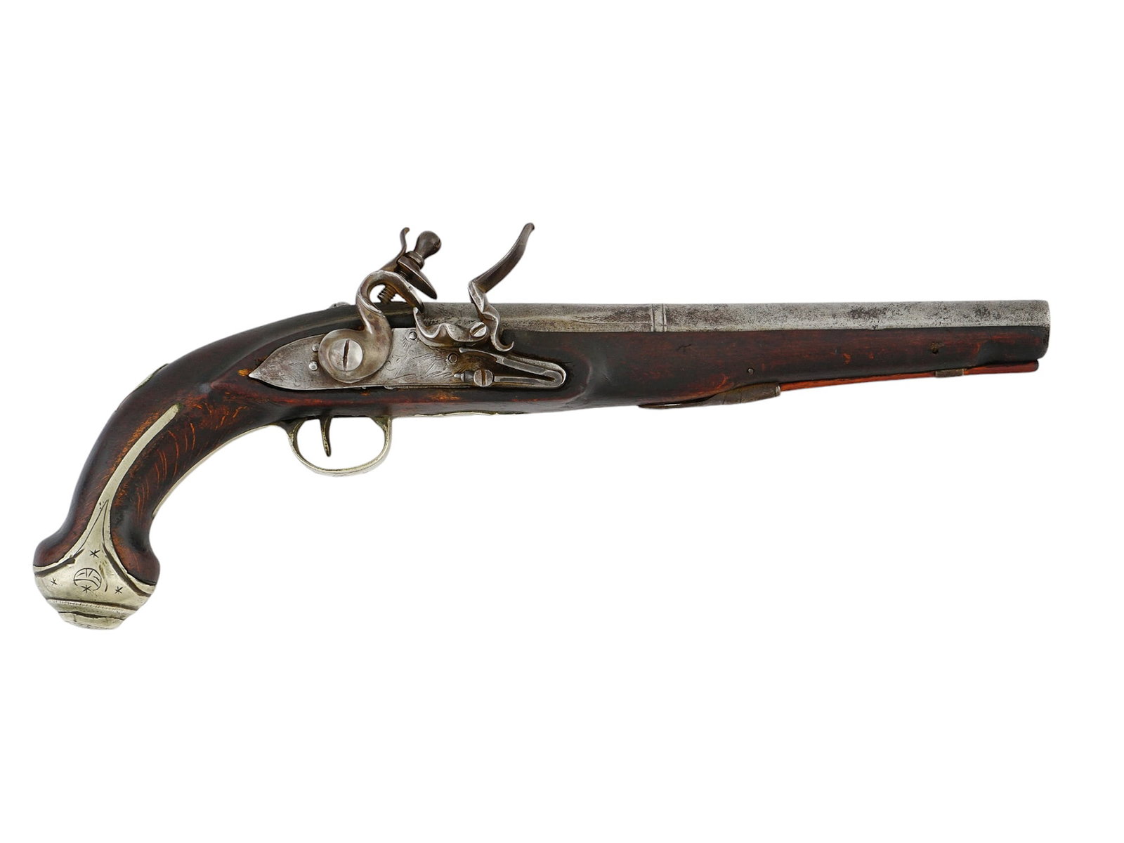 A FLINTLOCK PISTOL WITH ENGRAVED DECORATION. POSSIBLY SPANISH, 19TH C.: A flintlock pistol of the early 19th century bearing engraved decoration throughout, including many crescent moon and star motifs along the metal fixtures of the stock. The barrel itself is engraved w