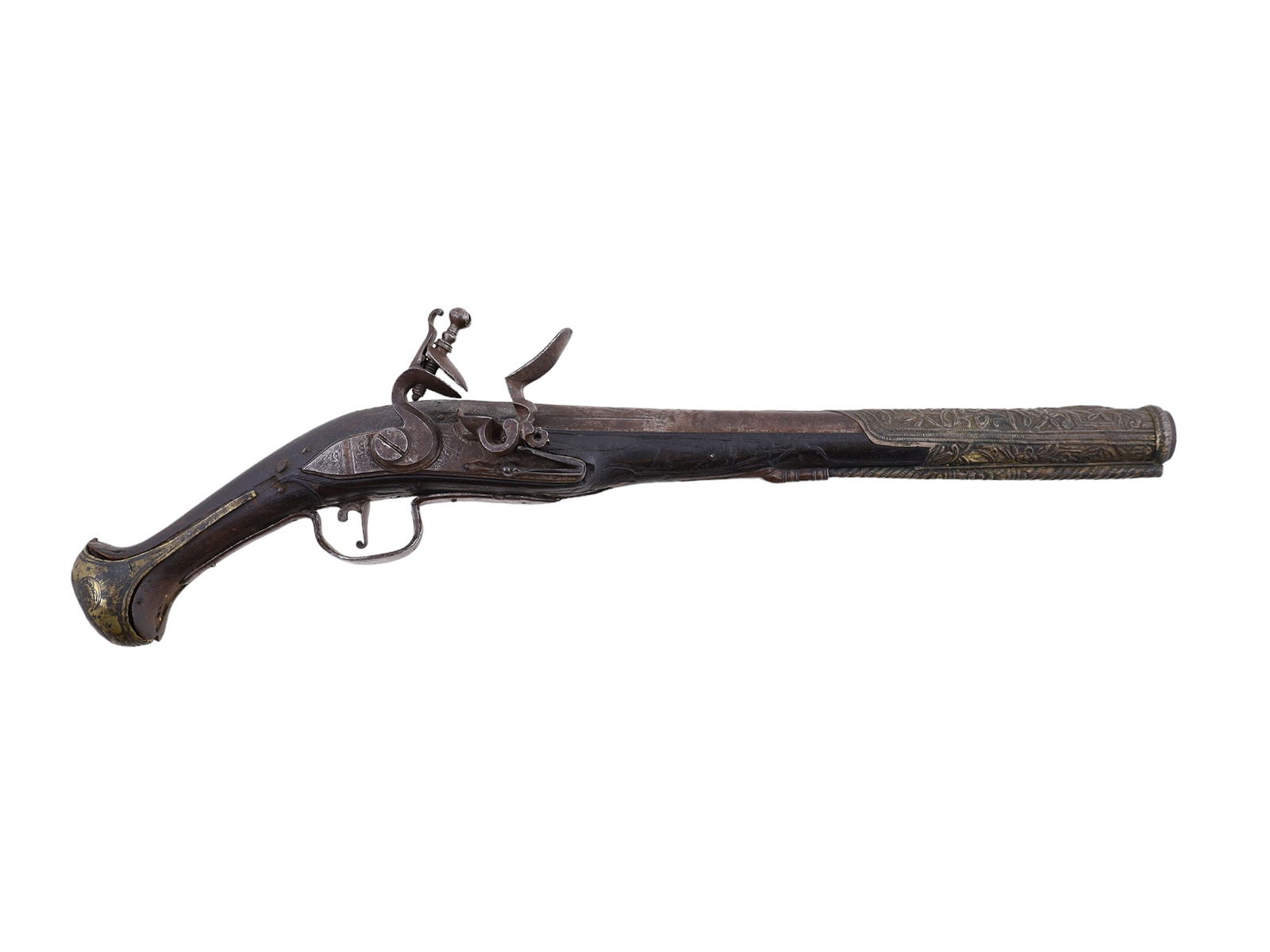 A TURKISH FLINTLOCK PISTOL IN SILVER MOUNTS, 18TH CENTURY: A single-shot Turkish flintlock pistol in silver mounts originating from the 18th century. This example's barrel band features a floral design as well as a dummy ramrod on the underside. The wood is s
