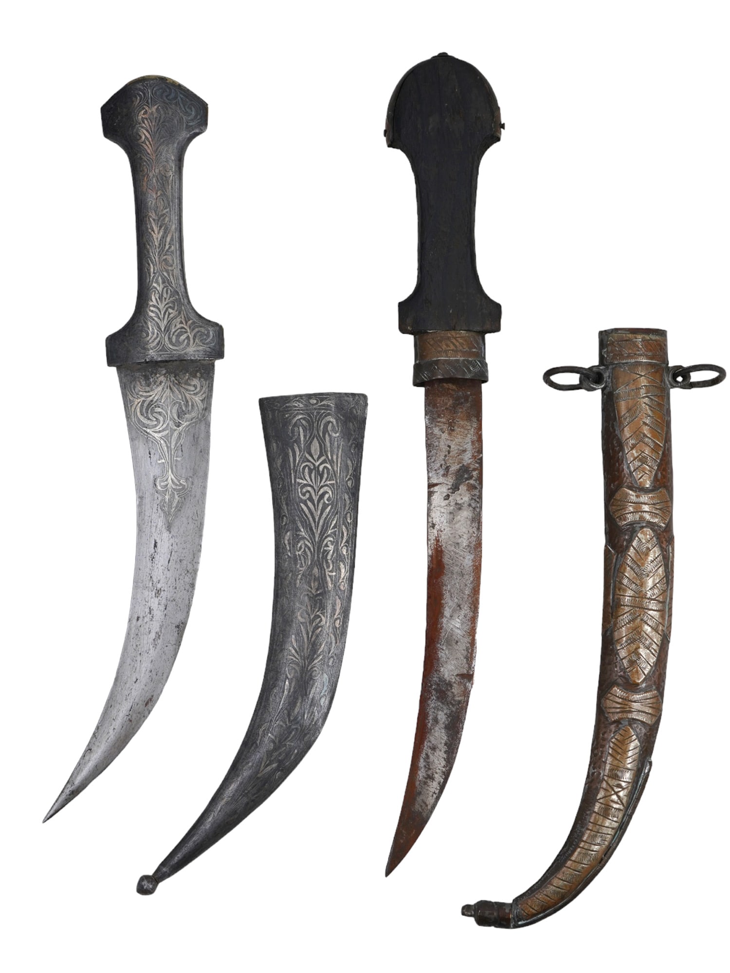 A SET OF TWO ISLAMIC WEAPONS: KHANJAR AND KOUMMYA DAGGERS: The first dagger is possibly a North African Koummya with a wooden handle and steel blade. It rests in a standard hilt that is brass mounted with some decorative elements. The second dagger is possibl