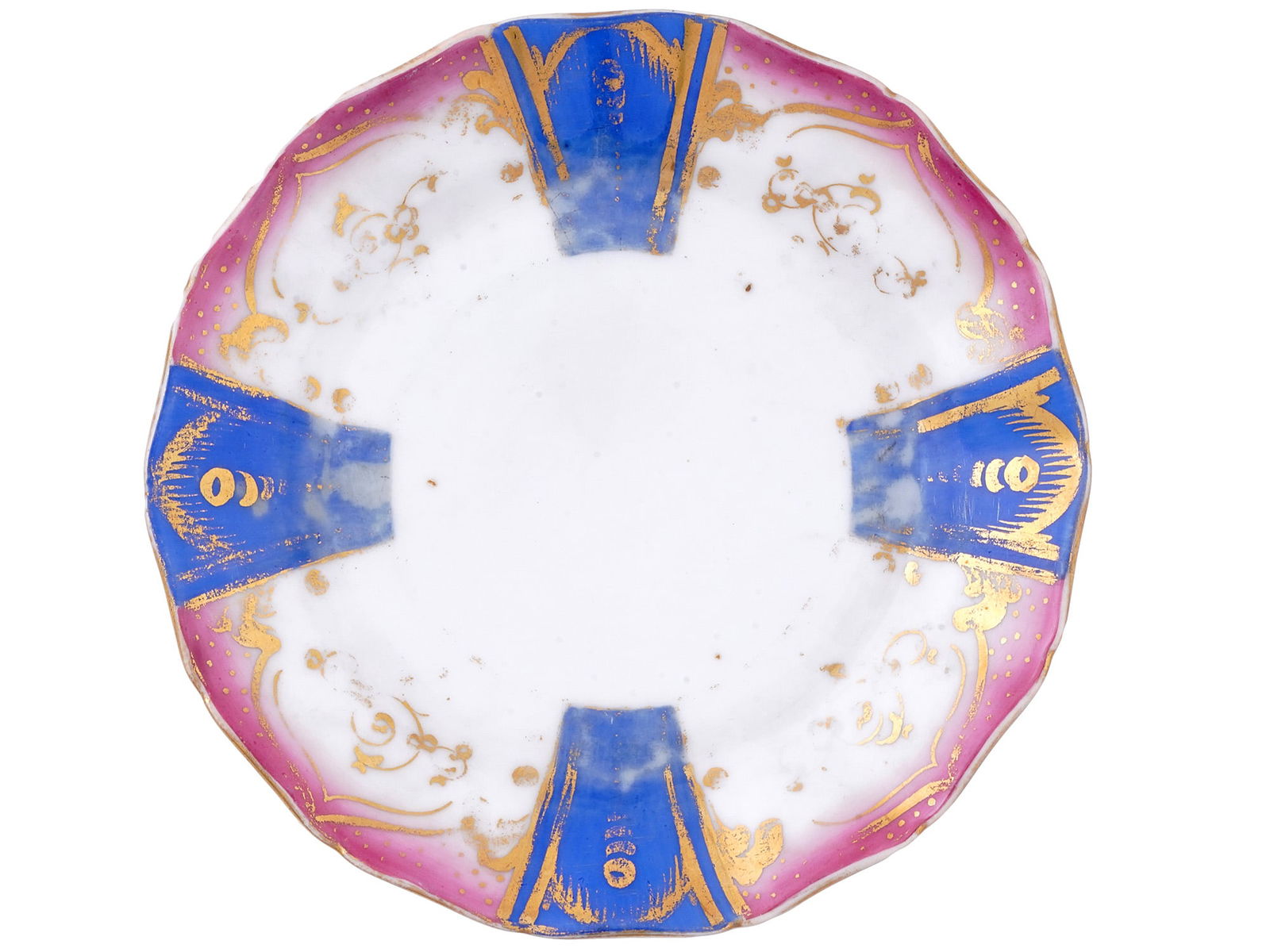 AN ANTIQUE FRENCH PORCELAIN SERVEWARE BREAD PLATE, C. 1870S: An antique French porcelain bread plate with bright blue painted sections and gilt decoration surrounded by a ring of magenta. No maker's marks present. Dimensions: D: 7 1/2 in., (19 cm.) Please make