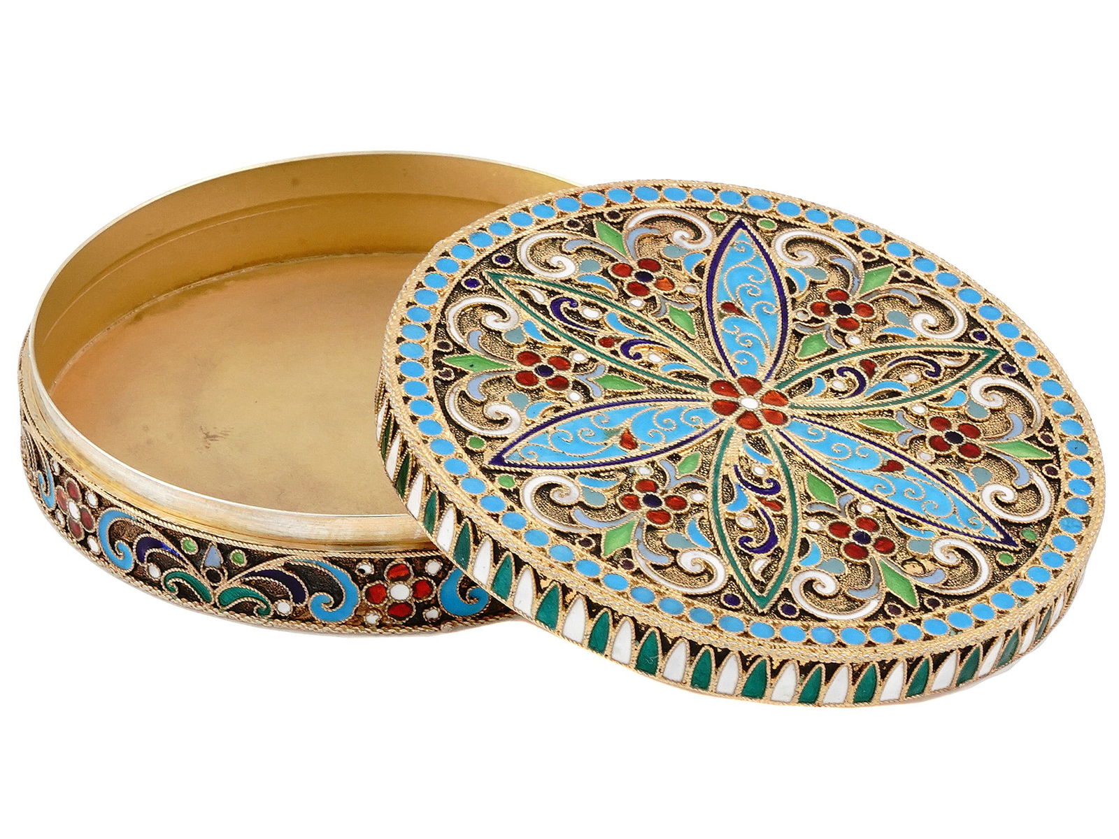 RUSSIAN SILVER AND ENAMEL PILL BOX, 1908-1917: RUSSIAN SILVER-GILT AND CLOISONNE ENAMEL PILL BOX. St. Petersburg, 1908-1917. Round pill box enameled with varycolored stylized scrolling foliage and geometric patterns on a gilt-stippled ground. Hall