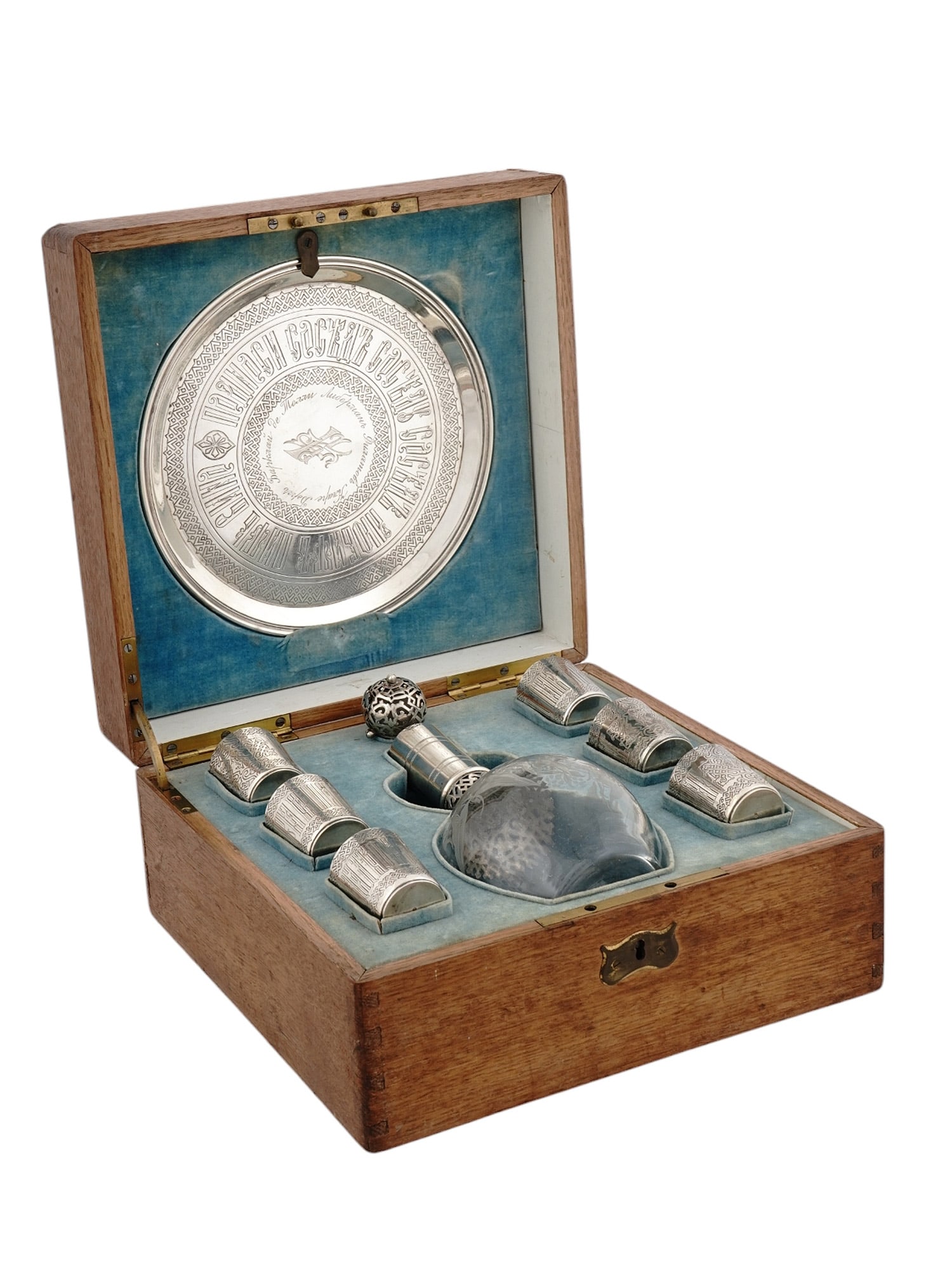 RUSSIAN SILVER VODKA SET IN BOX, GRACHEV, 1881: A RUSSIAN AND SILVER LIQUOR SET IN ORIGINAL BOX. Grachev Brothers, St. Petersburg, 1881. Comprising an 8-piece cased set, with engraved silver tray, six engraved vodka cups, an etched glass carafe wit