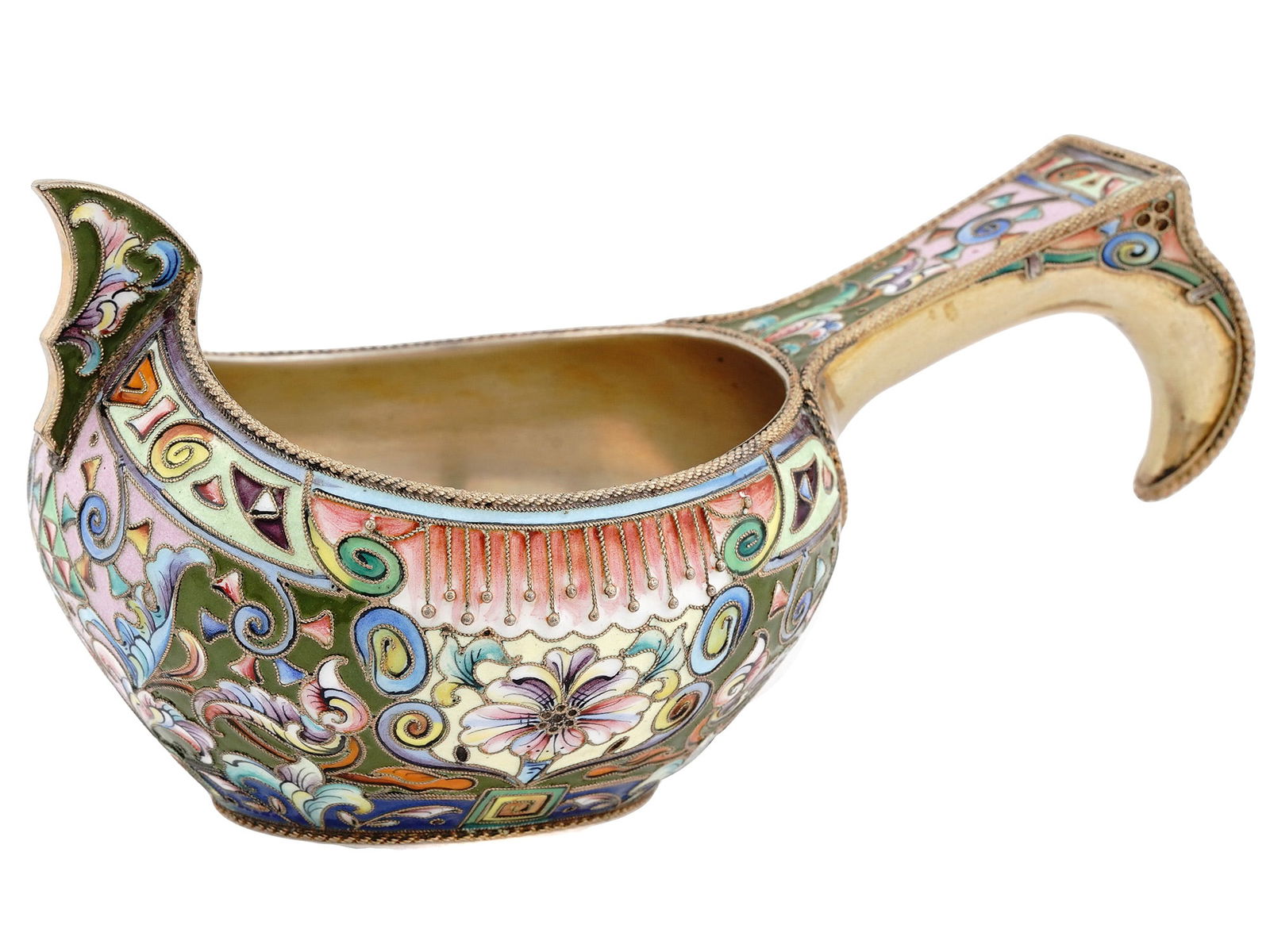 RUSSIAN SILVER AND ENAMEL KOVSH, 1908-1917: A RUSSIAN SILVER-GILT AND CLOISONNE ENAMEL KOVSH 6th Artel, Moscow, 1908-1917 Of traditional form, with a raised prow and a shaped hook handle, enameled with varicolored scrolling foliage and floral m