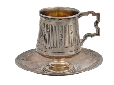 A RUSSIAN SILVER CUP AND SAUCER BY MILYUKOV, 1896