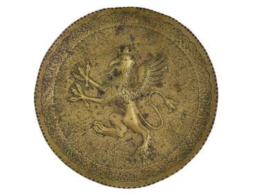 A GILT BRONZE PLATE WITH REPOUSSE GRIFFON, CA. 19TH CENTURY