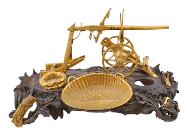 A BRONZE INKWELL REPRESENTING A PLOUGH, 19TH CENTURY.