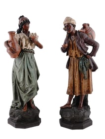 A PAIR OF TERRACOTTA MIDDLE EASTERN STATUES OF A MAN AND WOMAN