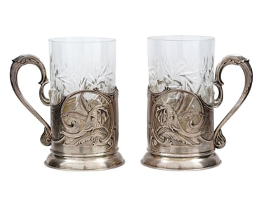 A PAIR OF RUSSIAN SILVER TEA GLASS HOLDERS W. SPOONS