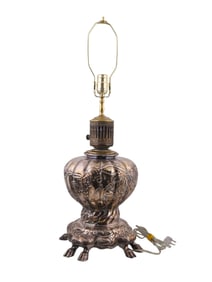 A SILVERED LAMP WITH COW FEET, CONVERTED TO ELECTRIC, PROBABLY GERMAN
