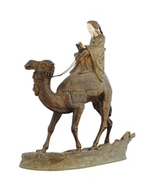 A FRENCH BRONZE OF A MOUNTED ARAB ON CAMEL BY A. LEONARD