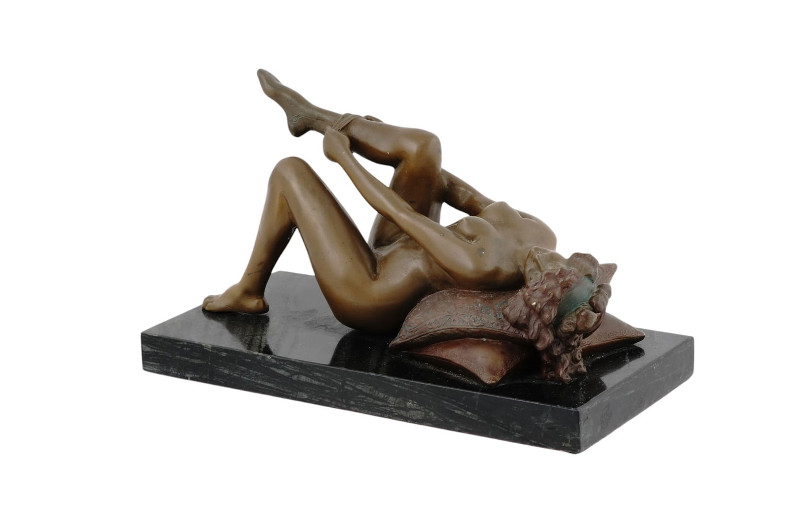 A LOUIS CHALON BRONZE FRECUMBANT FEMALE NUDE, EARLY 1900S: Louis Chalon (1866-1940), French, cold-painted, patinated bronze of a recumbent, nude female on pillows in the process of putting on leggings. The bronze is raised on a marble base and signed on the u