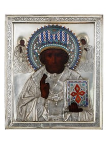 A RUSSIAN ORTHODOX SILVER OKLAD ST. NICHOLAS ICON, 19TH CEN.