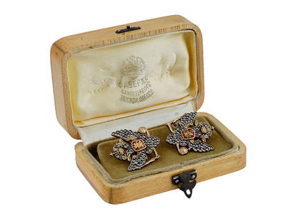 A CASED PAIR OF GOLD FABERGE-STYLE CUFFLINKS, RUSSIA: A cased pair of Faberge-style gold cufflinks in the form of the Russian Imperial Eagle, set with diamonds and decorated with enamel. Hallmarks: 56 Russian gold proof mark, "Ya.L.", artist's mark "A.N"