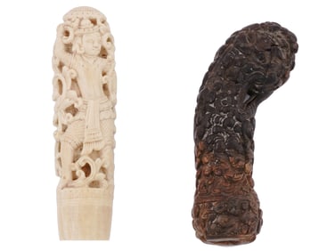 A PAIR OF CARVED MALAYSIAN KRIS DAGGER HILTS, 19TH CENTURY