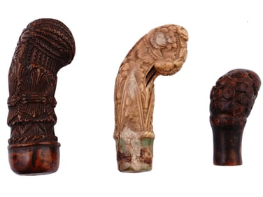 THREE CARVED MALAYSIAN KRIS DAGGER HILTS, 19TH CENTURY