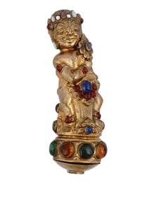 AN INDONESIAN KRIS HANDLE WITH GILT AND COLORFUL GLASS CABOCHONS