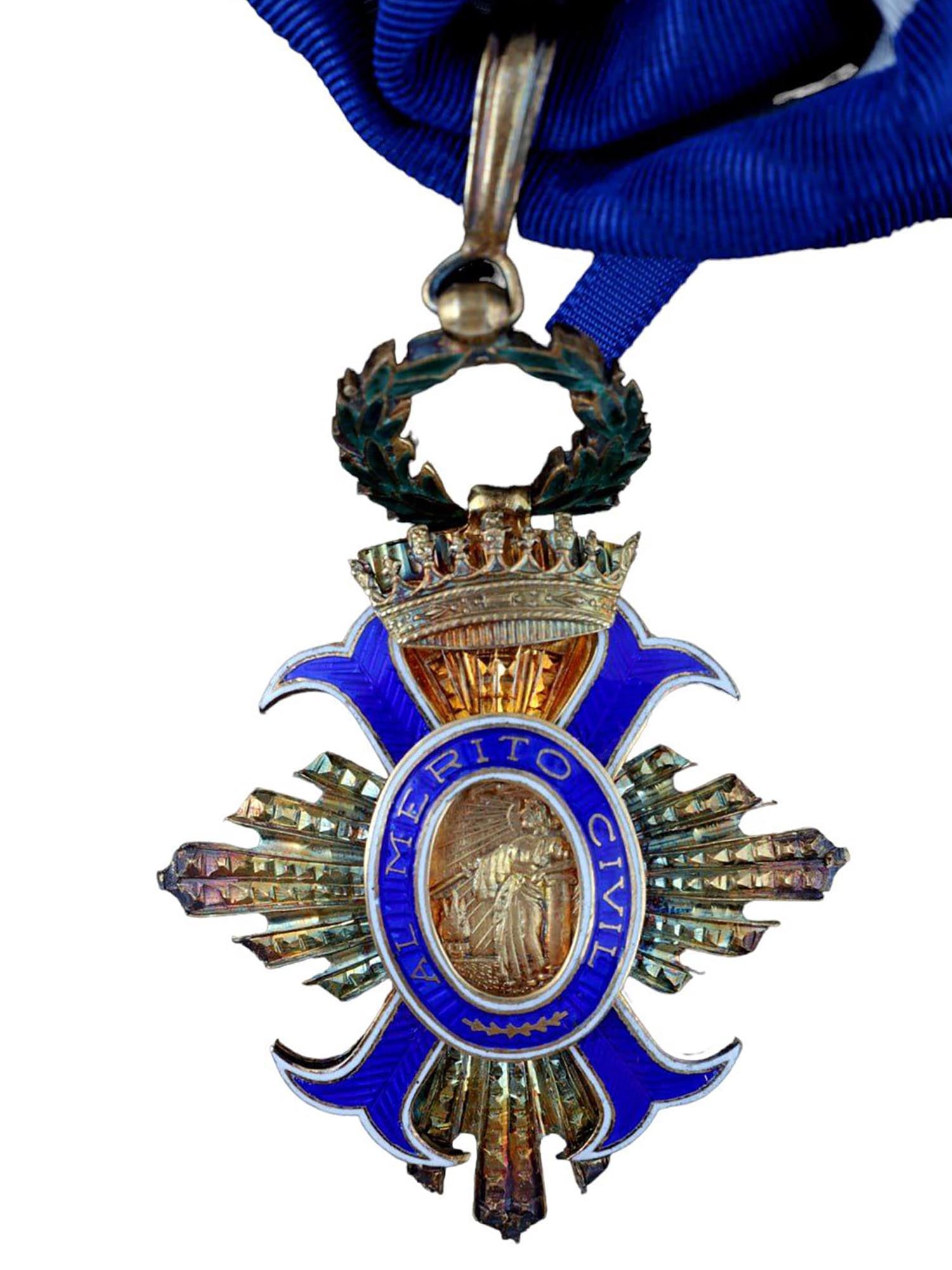 A CASED SPANISH ORDER OF CIVIL MERIT (ORDEN AL MERITO CIVIL), CA. 1950: An Order of Civil Merit (Orden al Mérito Civil), Commander Class, Spain, Franco Period, ca. 1950. Instituted in 1926. A silver gilt four-armed cross, obverse center featuring a superposed enameled bl