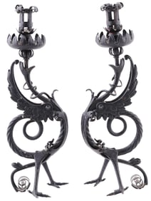 A RENAISSANCE WROUGHT IRON BESTIAL PAIR OF CANDLESTICKS