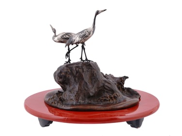 A JAPANESE GROUPING, SILVER CRANES ON BRONZE BASE, 20TH CENTURY
