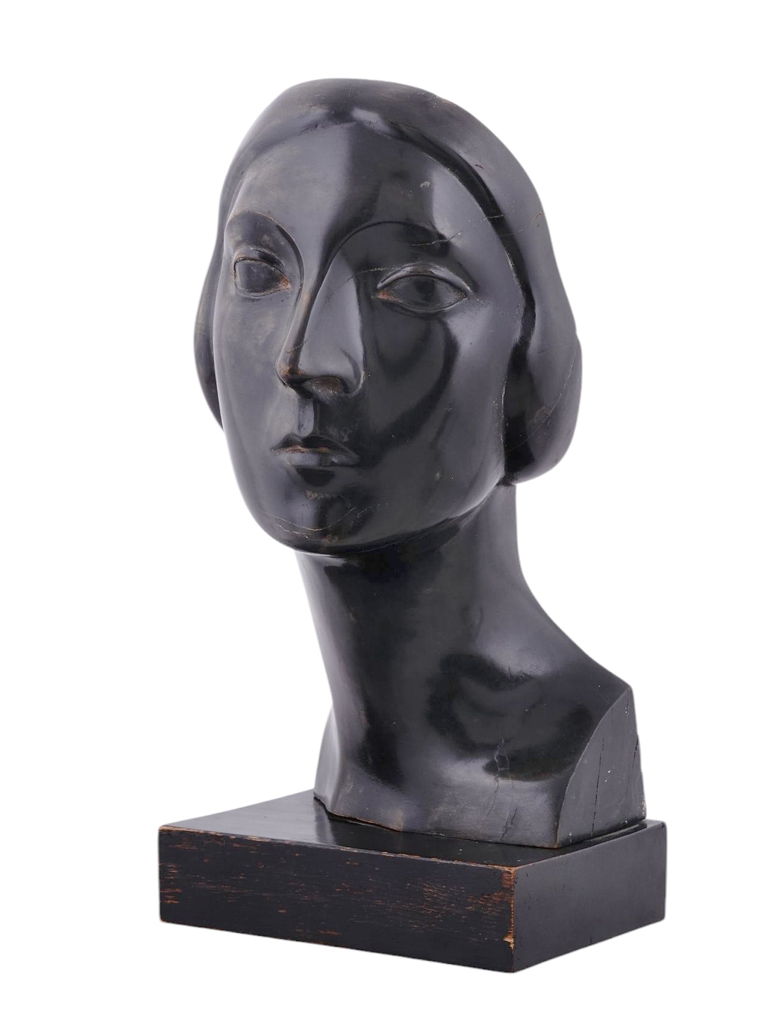 AN EUGENE KORMENDI-FRIM, HUNGARIAN, HAND-CARVED EBONIZED WOOD SCULPTURE, C. 1930: Eugene Kormendi-Frim (Hungarian, 1889–1959), a hand-carved ebonized wood sculpture depicting a female head, circa 1930s. Bears a carved artist's signature on the backside of the neck. Note: Eugene K
