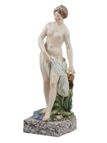 A ROYAL COOPENHAGER PORCELAIN FIGURE OF A STANDING NUDE