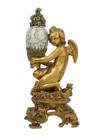 A GILT-BRONZE FIGURE OF A BOY WITH A PORCELAIN PAINTED EGG, CA. 1880