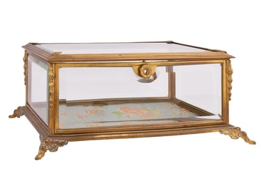 A FRENCH GILT METAL AND GLASS JEWELRY CASKET, LATE 19TH CENTURY