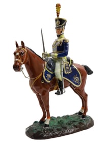 A PORCELAIN FIGURINE BY SITZENDORF OF A MOUNTED DRAGOON