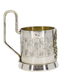 A RUSSIAN SILVER-GILT AND CHASED TEA GLASS HOLDER, MAKER ALEXANDER IOSIFOVICH FULF, MOSCOW, CIRCA