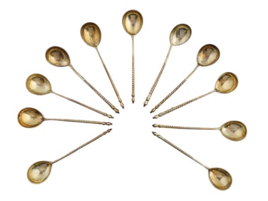 ELEVEN PARCEL-GILT ENGRAVED SILVER RUSSIAN TEASPOONS, 1887