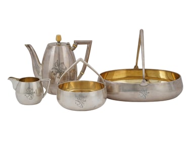 A RUSSIAN PARCEL-GILT SILVER SET BY GRACHEV, FOUR PIECES